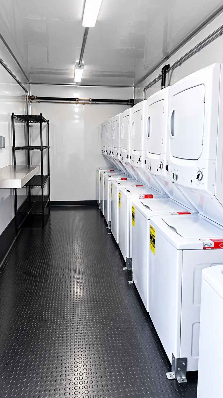 Laundry trailer interior with washers and dryers